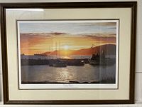 Full view of framed limited edition print "Evening Splendor" by Kathryn Mullaney showing the harbor sunset, wood frame and white matting.