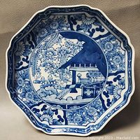 Top view of the octagonal blue and white bowl showing floral and architectural motifs.
