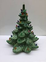 Front angle showing the green ceramic tree with colorful bulbs arranged on branches