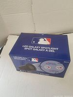 Photo of the unopened LED Galaxy Spotlight box showing team logos and branding