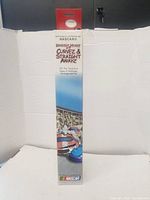 Full view of the NASCAR Griddly Headz Curvez & Straight Awayz board game box showing the title, licensing, and artwork.