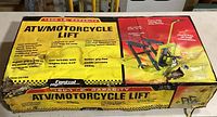 Box labeled Central Hydraulics ATV/Motorcycle Lift showing 1500 lb capacity and product image.