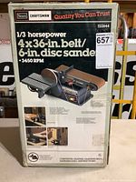 Front of sealed box showing Craftsman 1/3 horsepower 4x36 inch belt and 6 inch disc sander specifications and image.