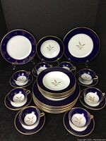 Overall lot arranged with Dignity plates, bowls, cups and saucers, with Charlemagne plates at back