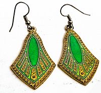 Pair of vintage Art Deco motif earrings showing the front, highlighting green enamel and gold-tone geometric design with wire hook attachments.