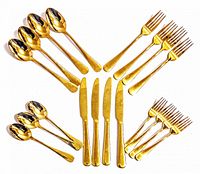 Vintage stainless steel cutlery pieces arranged in groups on a white background. Includes spoons, forks, and knives with polished rounded handles.