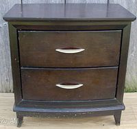 Front-facing view of the mahogany 2-drawer night table showing two silver handles and some surface wear.
