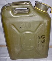 Front side of the 20L military fuel container with embossed capacity marking and faint black stencil markings.