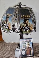 Front view of the Larry the Cable Guy themed glass panel lamp showing six glass panels with the image and text and the lamp base.