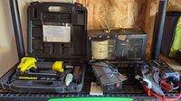 Full view of all items on shelf including barograph, Noco Genius power pack, power inverter, and staple tool case