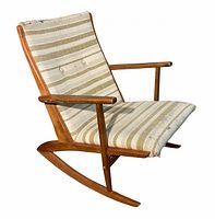 Side view of teak rockers and upholstered seat