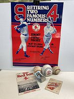 Photo shows all items displayed including the Red Sox poster, baseballs, 1964 program, baseball cards, and 1947 booklet.