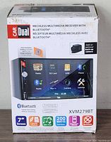 Box showing product branding, features, and specifications for Dual XVM279BT 7" mechless multimedia receiver with Bluetooth.