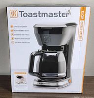 Box of Toastmaster 12 cup coffee maker showing front image and key features.