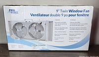Box of Cool Works 9 inch twin window fan with key features listed on the box.