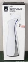 Front view of box showing product and brand name Umbra Otto automatic soap and sanitizer dispenser with 250 ml capacity.