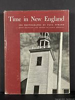 Front cover of the photography book showing the title and black and white photo of a church steeple under cloudy sky.