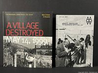 Cover of 'A Village Destroyed: May 14, 1999' and 'Agusti Centelles: The Concentration Camp at Bram, 1939' hardcover book.