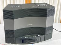 Front view of Bose Acoustic Wave Music System II showing entire unit and grille pattern