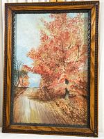 Full view of framed print showing autumn country road scene with orange and red leaves and decorative wooden frame.