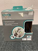 Front view of PetSafe Rechargeable Bark Control Collar box with price tag and dog image