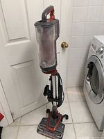 Full view of Shark upright vacuum cleaner model LZ602 showing overall assembled unit with transparent dust container and handle.