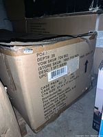 Shipping box with label showing SKU, description, and distribution details for 7.5 ft Sierra Nevada Christmas tree.