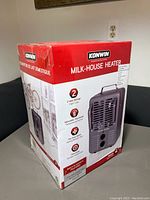 Photo of the sealed boxed Konwin Milk-House Heater showing brand, features, and packaging.