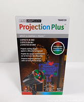 Box front showing LED LightShow Projection Plus Christmas projector with North Pole sign images and features.