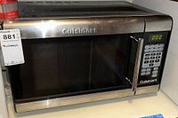 Front view of Cuisinart microwave with stainless steel finish showing the door and handle along with control panel and LED display.