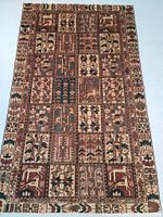 Full flat lay view of the rug showing overall panel pattern and border details