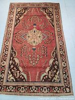 Full view of top side showing central medallion, field and border