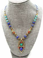 Front view of the necklace on display showing the overall design and pendant details