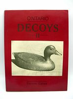 Front cover of Ontario Decoys II book showing title, author Bernie Gates, and a black and white image of a duck decoy against a red background.