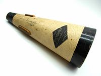 Trumpet mute angled to show crackled cream body and black trim on ends