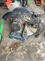 Mastercraft mitre saw showing the motor, handle, and blade guard.