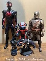 Full view of all four figures including Spider-Man, Ant-Man, Mandalorian, and Black Panther