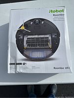 Front view of sealed iRobot Roomba 692 box showing branding and model