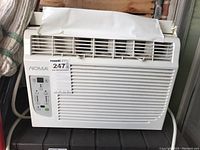 Front view of NOMA air conditioner, showing vent and control panel.