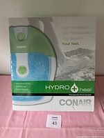 Photo of the Conair Hydro Heal Therapeutic Foot Jacuzzi box showing the product image and features including invigorating bubbles, soothing heat, and pinpoint massage.