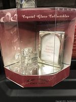 Front view of Lovingbox edition crystal elephant figurine in red and clear display box with mirrored base, showing the figurine and plaque inside.