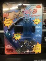 Front view of Etch It The Engraver tool sealed in original packaging, showing blue plastic engraver, instructions highlights and wrist strap.