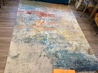 Full-length view of rug laid out on floor showing pattern and condition