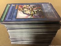 Stack of Yu-Gi-Oh cards showing edge view revealing thickness and condition of the card edges