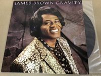 Photo of the James Brown Gravity vinyl LP cover showing the artist smiling and the title text.