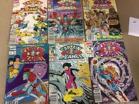 Six Captain Planet comic books laid out on a surface, showing colorful covers and varying character scenes.