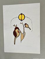 Full view of the silkscreen print showing three stylized birds on branches under a round yellow and black emblem with some pen signatures.