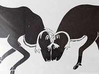 Close-up image of the black silhouette print showing two caribou butting heads, focusing on the animals.