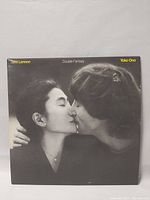 Front cover of Double Fantasy album showing John Lennon and Yoko Ono kissing