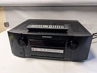 Front view of Marantz SR6005 receiver with remote on top